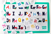 Alphabet Placemat for Kids, Alphabet Placemat, Alphabet Placemats, ABC Placemat, ABC Placemats, Placemat featuring simple phonics illustrations, engaging placemat for two year olds, placemats for children, kids playing with placemat.